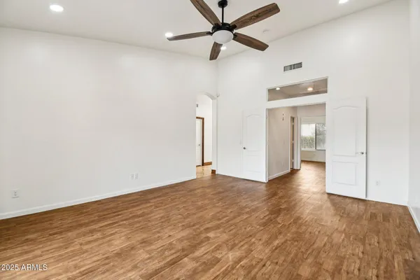 a view of a livingroom with furniture wooden floor and window
