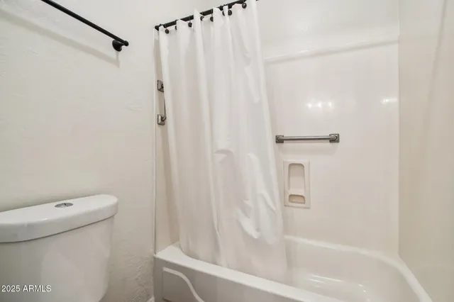 an empty room with closet area