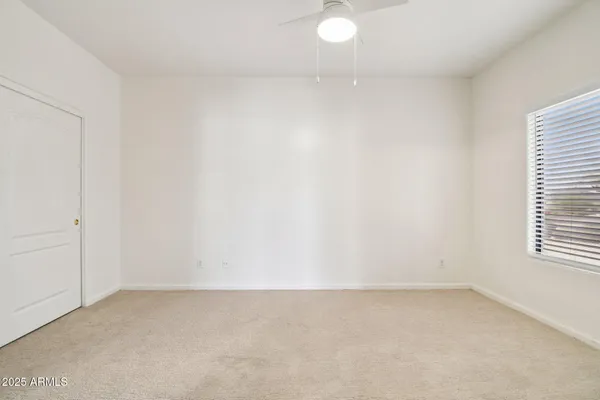 a bathroom with a granite countertop sink toilet mirror vanity and shower