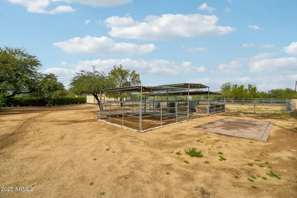 a front view of a house with a garden and yard