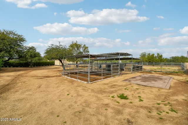 a front view of a house with a garden and yard