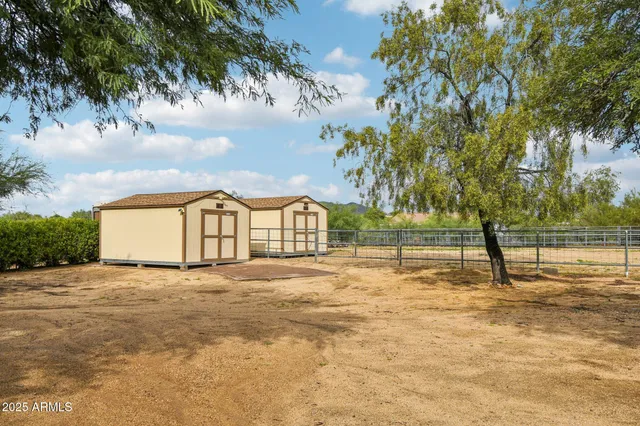 a front view of a house with yard and outdoor seating