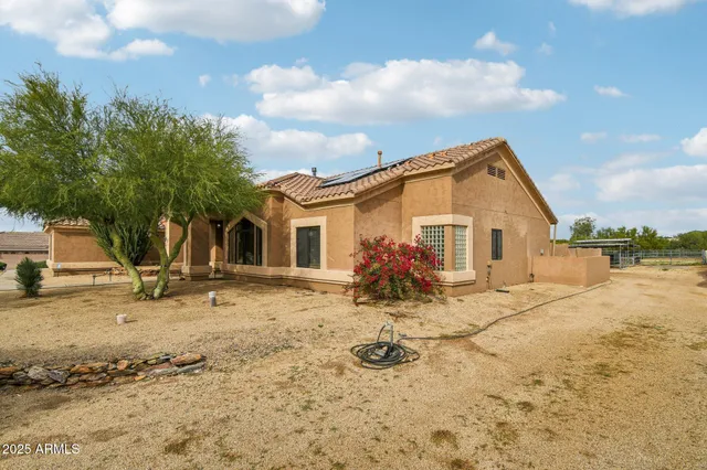 a view of a white house with a outdoor space