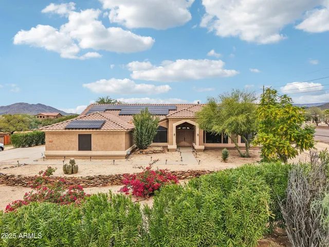 an aerial view of residential houses with city view