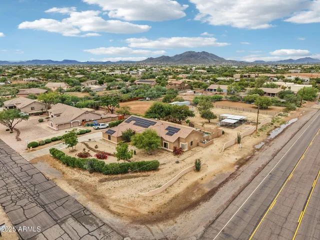 an aerial view of residential building with city view