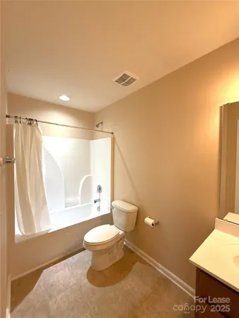 a bathroom with a toilet sink and a shower