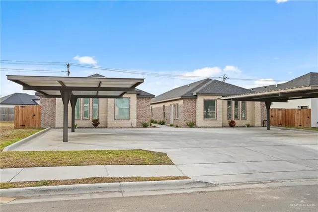 a view of a house with a swimming pool and sitting area