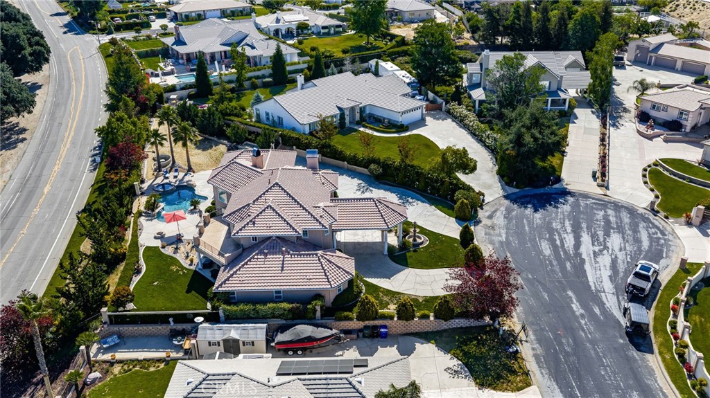 38136 Butterfly Court Yucaipa, CA 92399 - Photo 70 of 71 an aerial view of a house with a swimming pool patio and outdoor seating