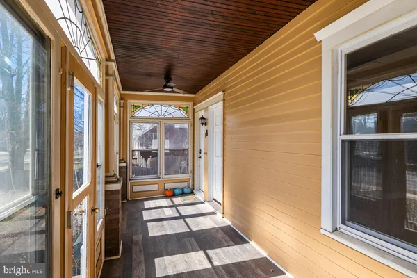 a view of a balcony with wooden floor