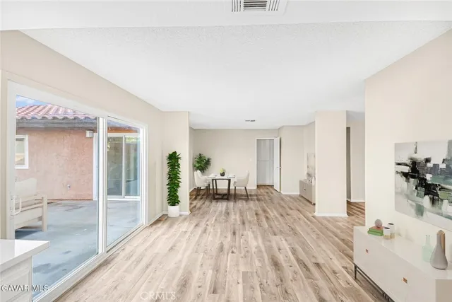 a bedroom with a large bed and a flat screen tv