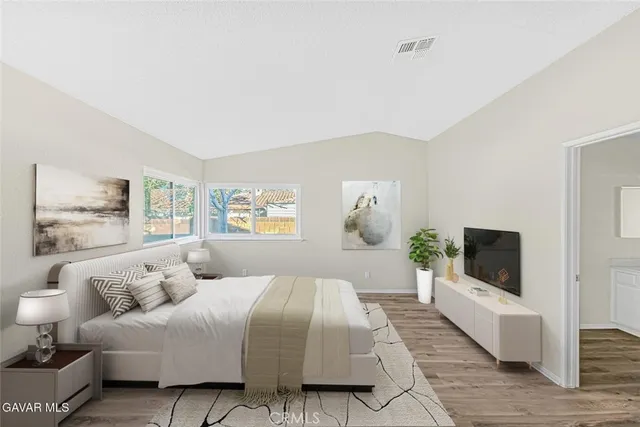 a living room with furniture and a lamp