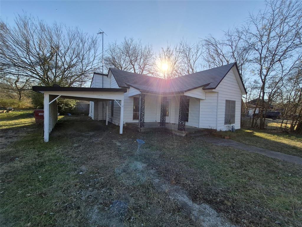 307 West Spruce Street Whitewright, TX 75491 - Photo 12 of 12 a view of a house with a yard and tree