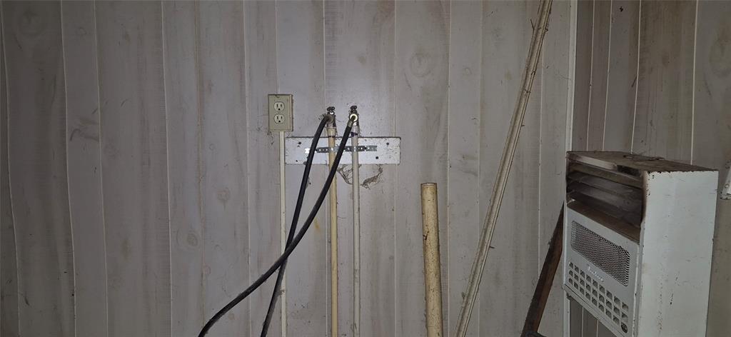 307 West Spruce Street Whitewright, TX 75491 - Photo 7 of 12 a view of a hallway with wooden shelves