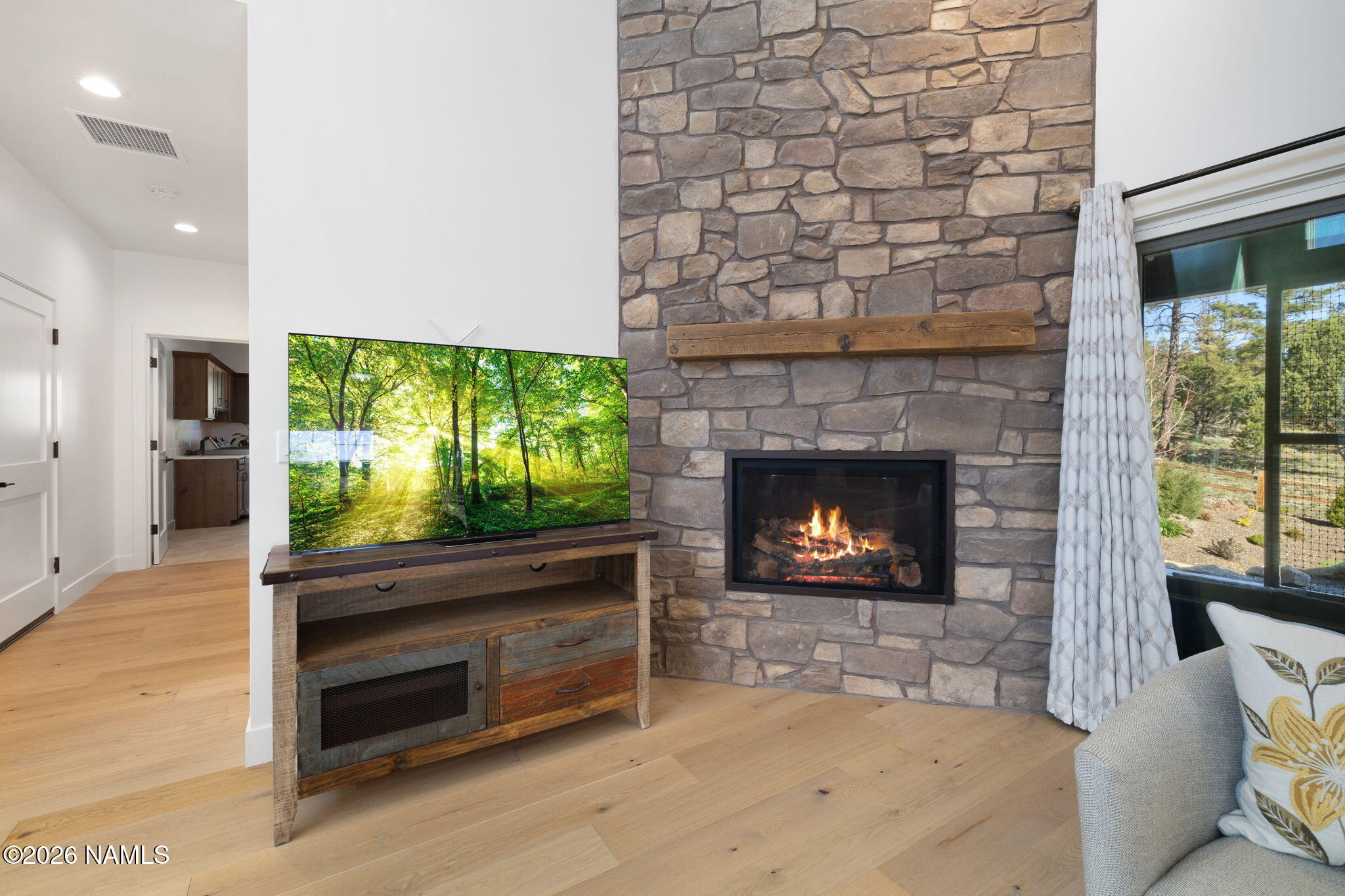 2672 Ridgewood Way Williams, AZ 86046 - Photo 12 of 57 Stone fireplace anchors the living area