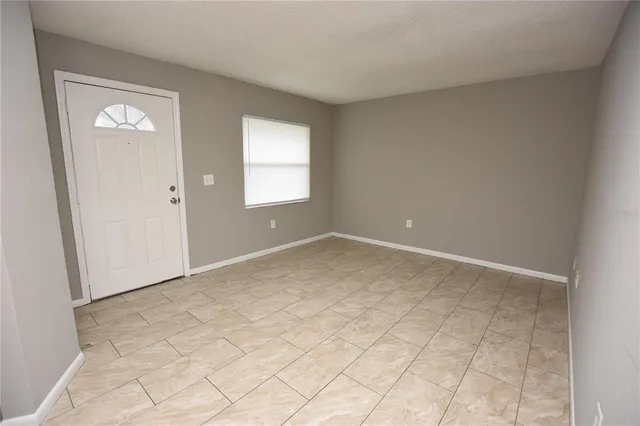 a view of an empty room with a window