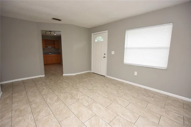 a view of an empty room with a window