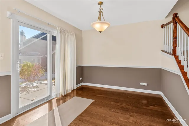 a view of room with window and wooden floor