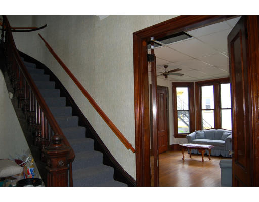99 Sedgwick Street Boston, MA 02130 - Photo 11 of 14 a balcony with outdoor seating and wooden floor