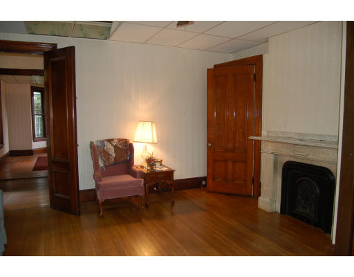 99 Sedgwick Street Boston, MA 02130 - Photo 6 of 14 a living room with furniture and a fireplace