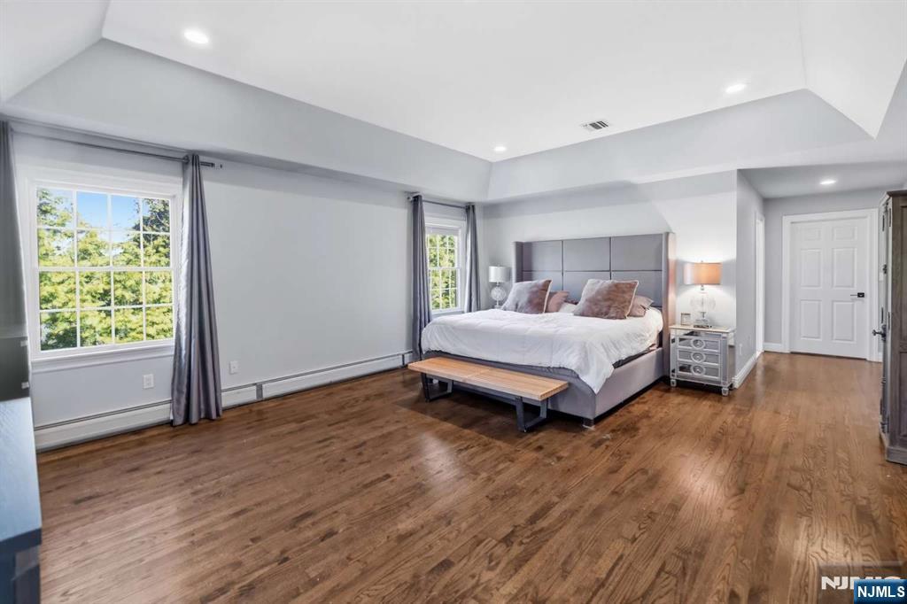 8 Wainwright Court Closter, NJ 07624 - Photo 12 of 29 a bedroom with a bed and a window