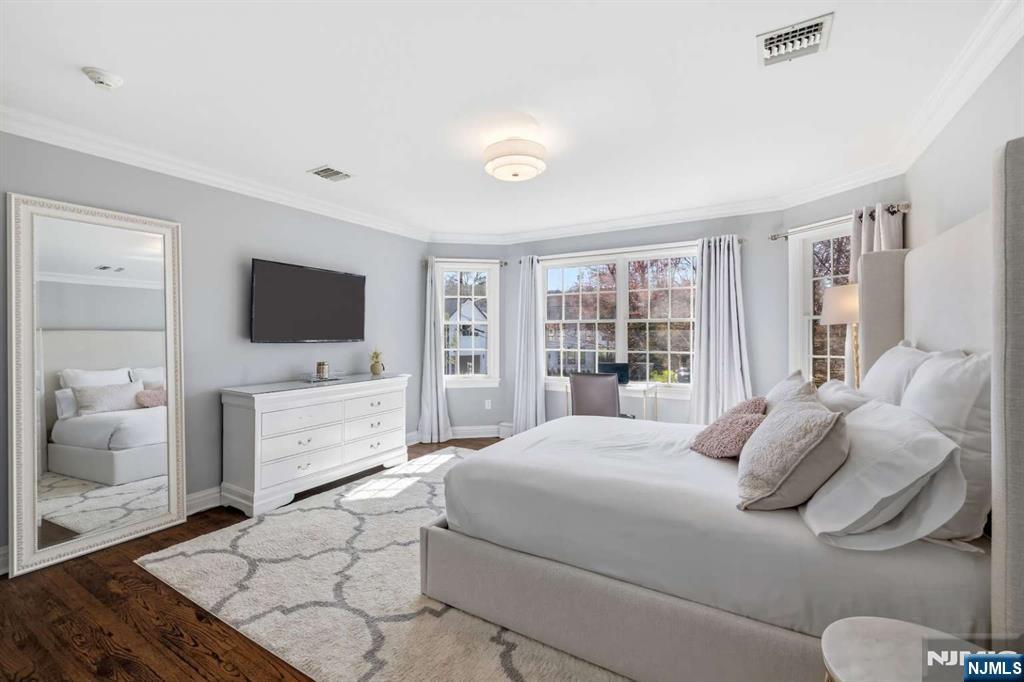 8 Wainwright Court Closter, NJ 07624 - Photo 15 of 29 a bedroom with a bed and a flat screen tv