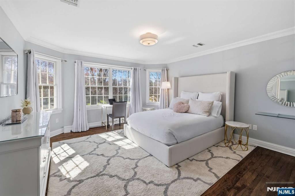 8 Wainwright Court Closter, NJ 07624 - Photo 16 of 29 a bedroom with a large bed and a window