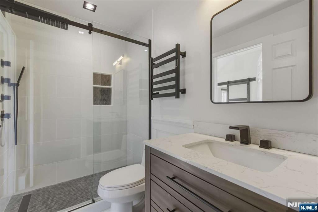 8 Wainwright Court Closter, NJ 07624 - Photo 20 of 29 a bathroom with a sink a toilet and shower