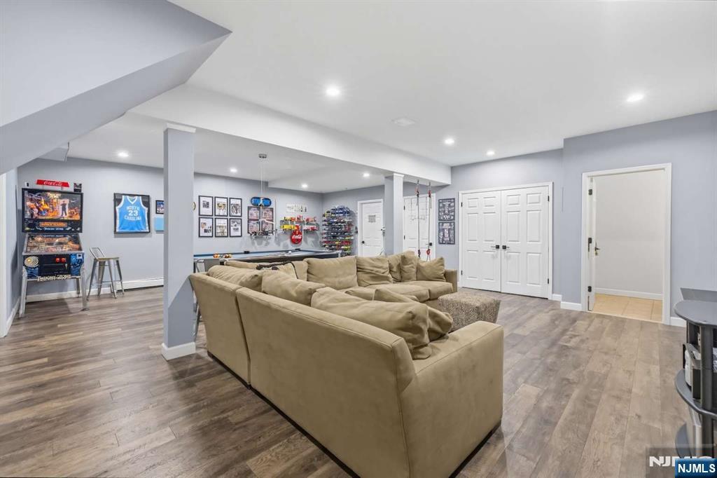 8 Wainwright Court Closter, NJ 07624 - Photo 23 of 29 a living room with furniture and a wooden floor