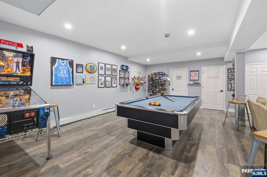 8 Wainwright Court Closter, NJ 07624 - Photo 24 of 29 a room with furniture pool table and a flat screen tv