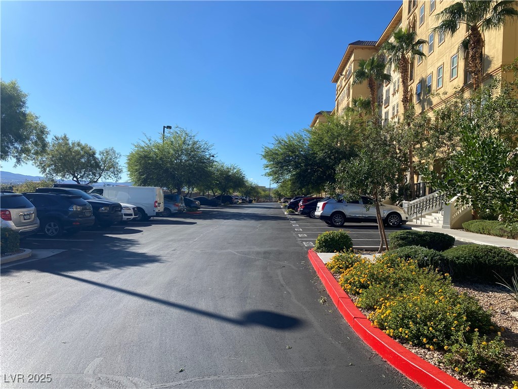 2405 West Serene Avenue, Unit 827 Las Vegas, NV 89123 - Photo 12 of 48 View of asphalt road with curbs
