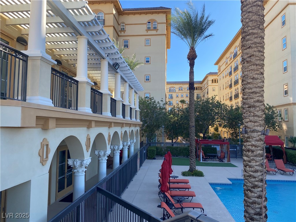 2405 West Serene Avenue, Unit 827 Las Vegas, NV 89123 - Photo 15 of 48 View of property's community with a pergola, a pool, and a patio