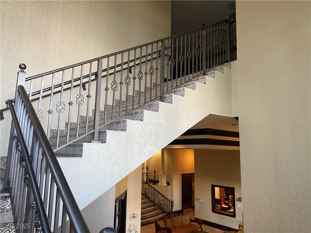 2405 West Serene Avenue, Unit 827 Las Vegas, NV 89123 - Photo 23 of 48 Staircase featuring a high ceiling