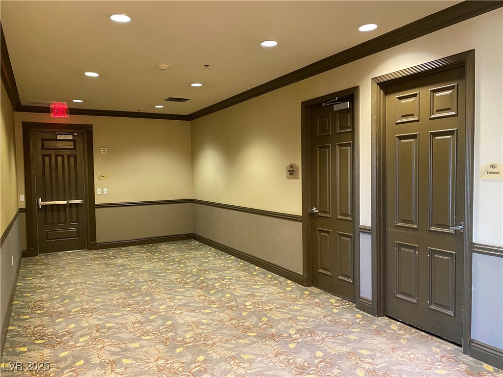 2405 West Serene Avenue, Unit 827 Las Vegas, NV 89123 - Photo 30 of 48 Empty room with crown molding and recessed lighting