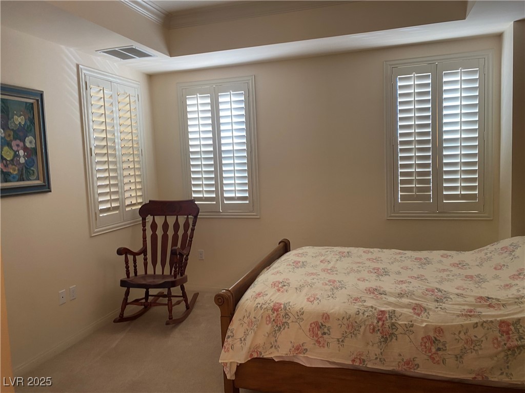 2405 West Serene Avenue, Unit 827 Las Vegas, NV 89123 - Photo 43 of 48 Bedroom with light colored carpet and crown molding