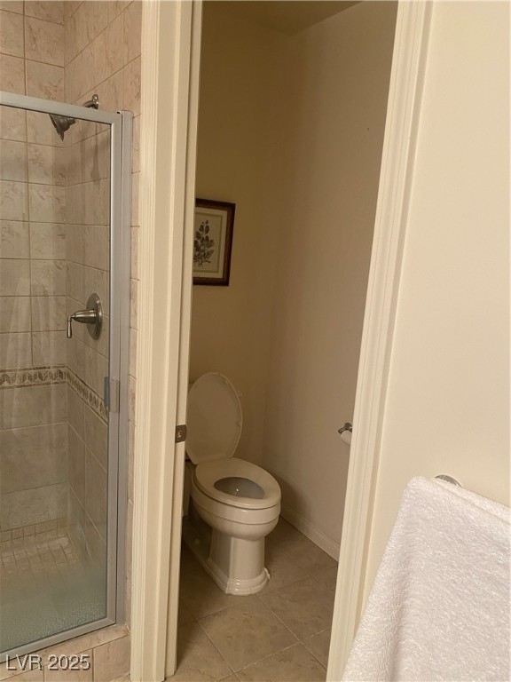 2405 West Serene Avenue, Unit 827 Las Vegas, NV 89123 - Photo 47 of 48 Bathroom featuring a stall shower and light tile patterned flooring