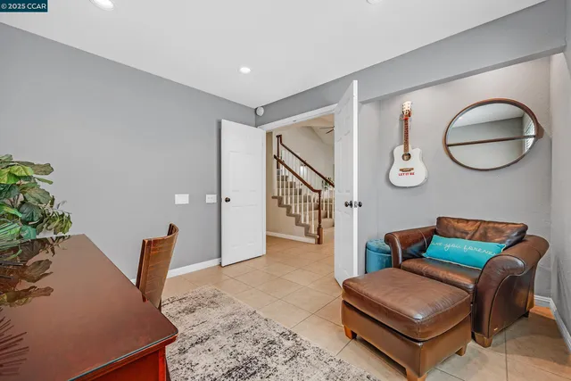a living room with furniture and a rug