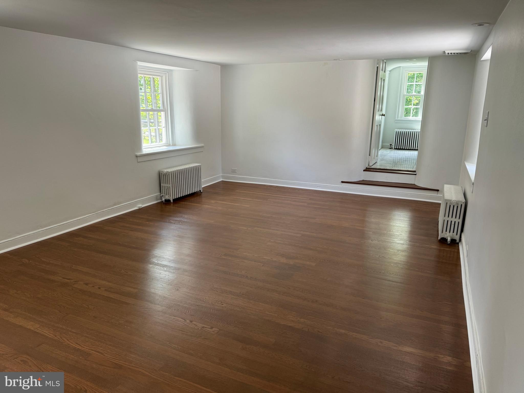 553 Worthington Road Chester Springs, PA 19425 - Photo 12 of 33 an empty room with wooden floor and windows