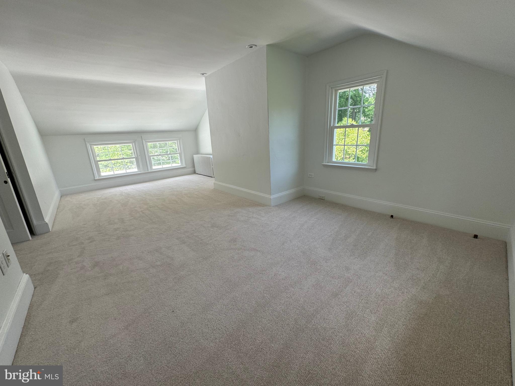 553 Worthington Road Chester Springs, PA 19425 - Photo 22 of 33 an empty room with a window and a mirror