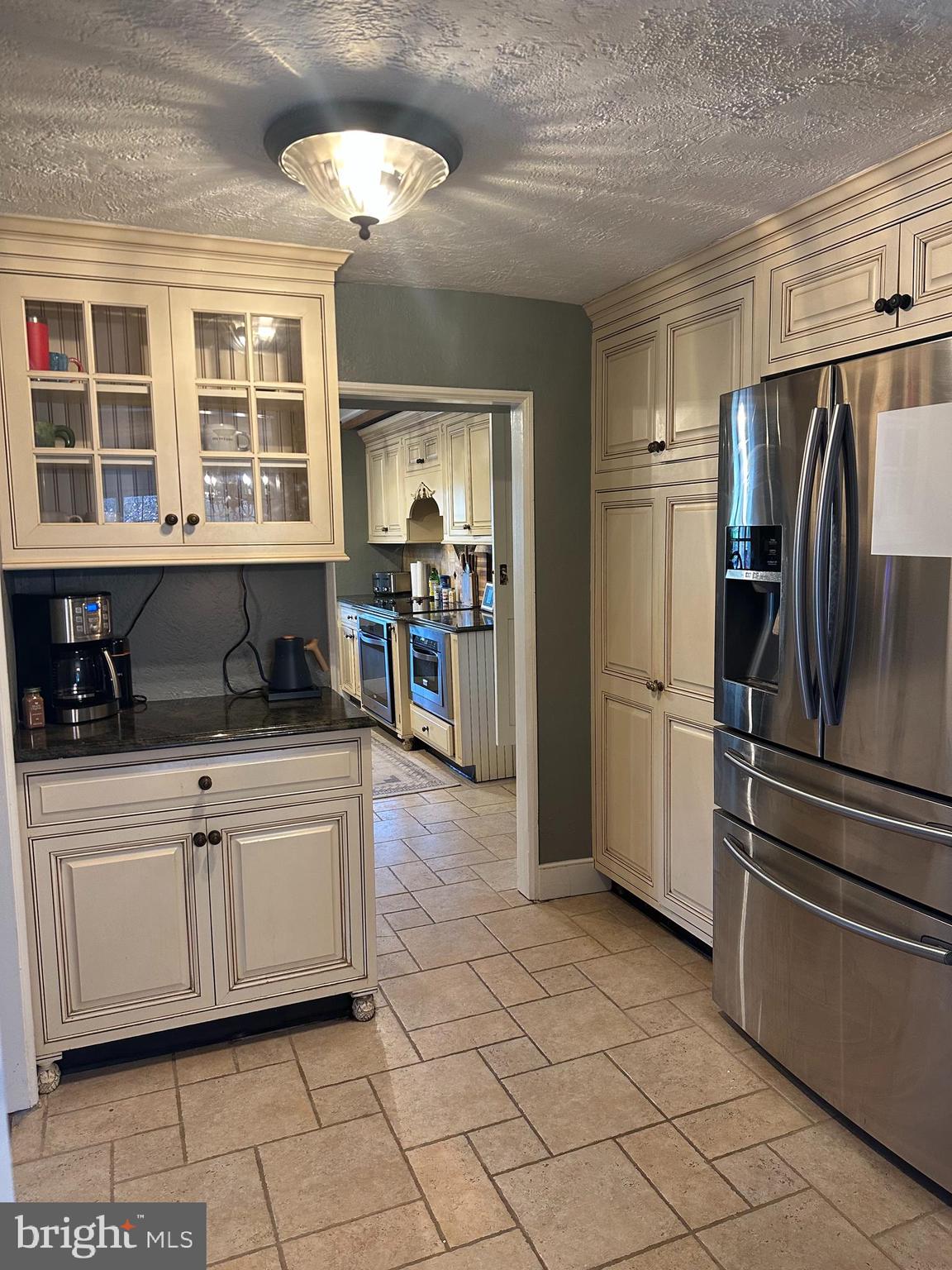 553 Worthington Road Chester Springs, PA 19425 - Photo 3 of 33 a kitchen with stainless steel appliances granite countertop a refrigerator and a sink
