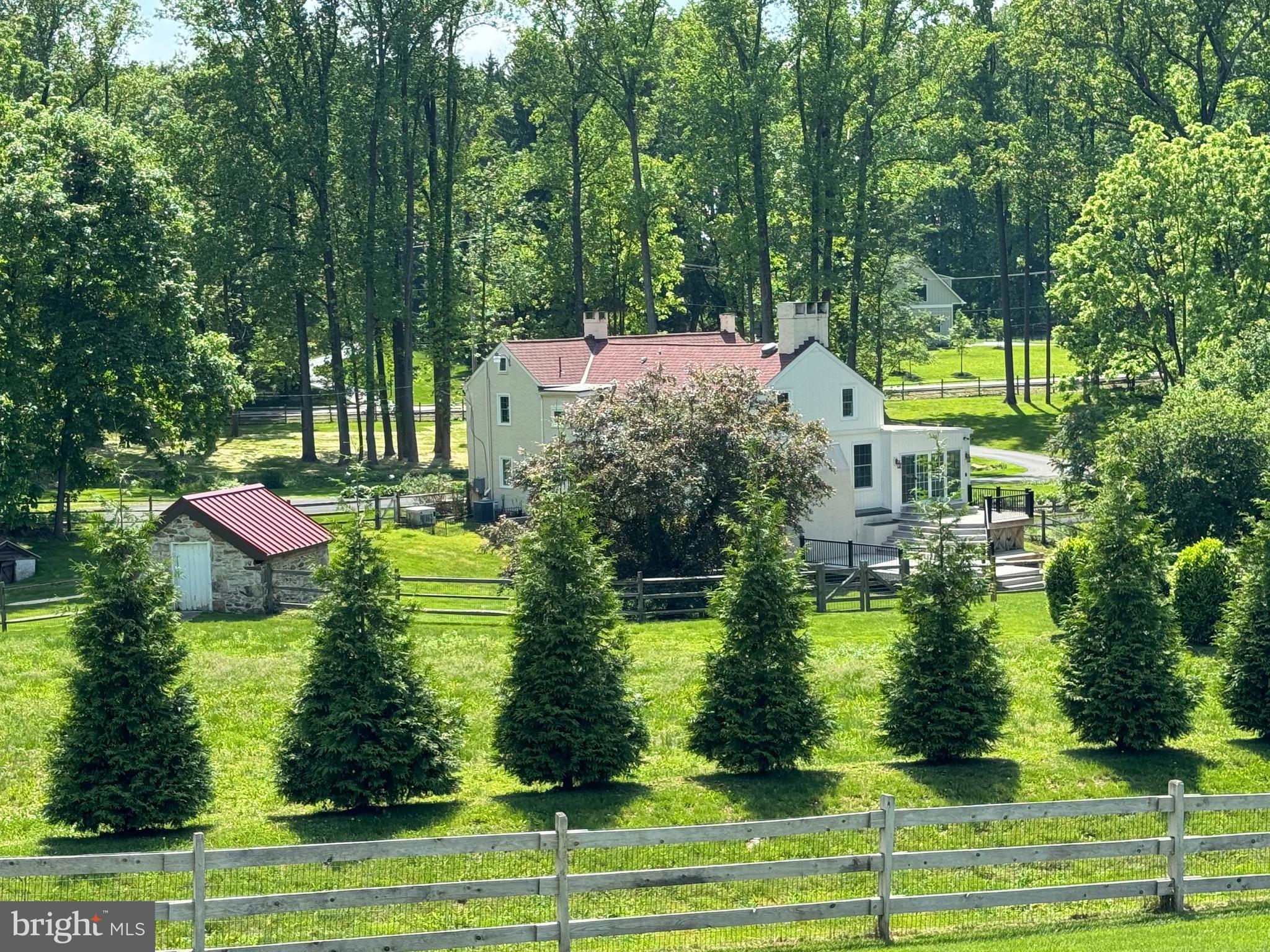 553 Worthington Road Chester Springs, PA 19425 - Photo 32 of 33 a swimming pool with trees in the background