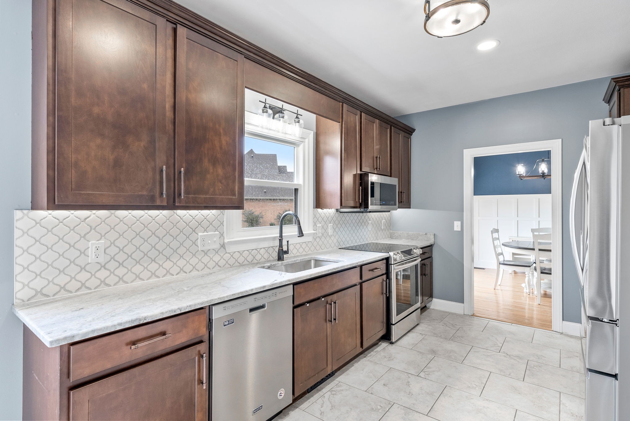 4921 Sango Road Clarksville, TN 37043 - Photo 18 of 52 a kitchen with a sink and a refrigerator