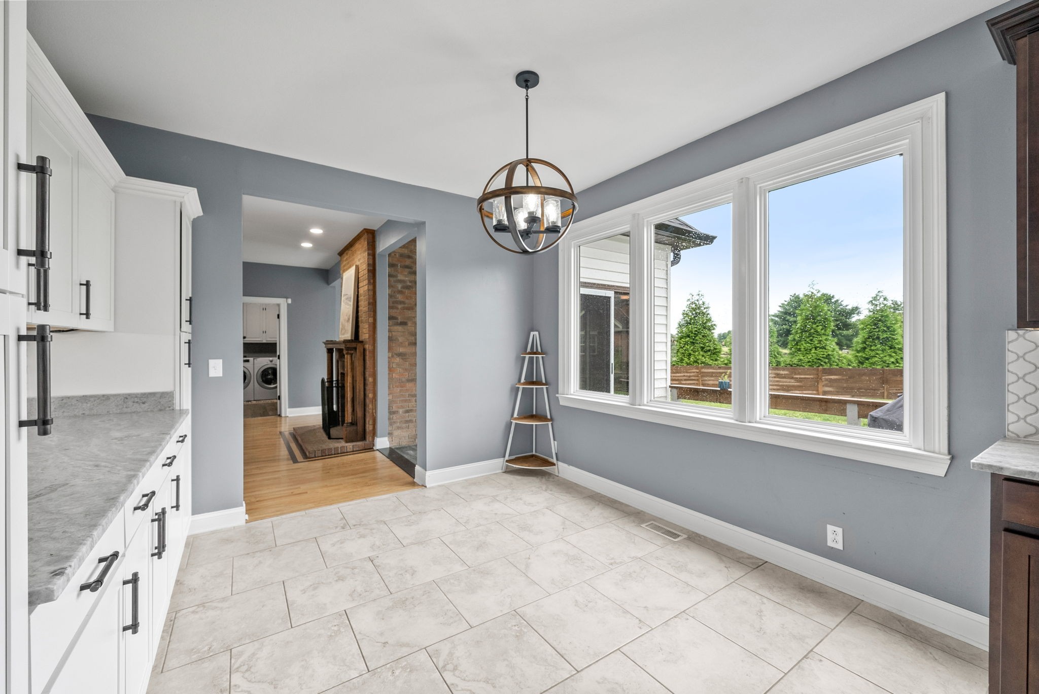 4921 Sango Road Clarksville, TN 37043 - Photo 21 of 52 a view of a hallway with windows and chandelier