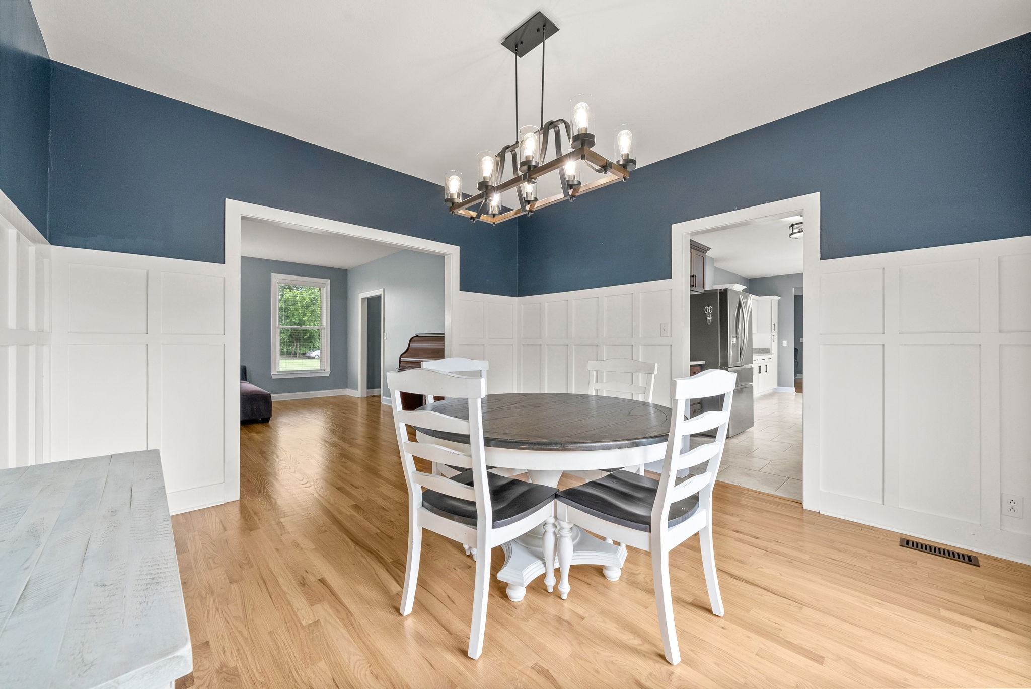 4921 Sango Road Clarksville, TN 37043 - Photo 23 of 52 a view of a dining room with furniture and chandelier