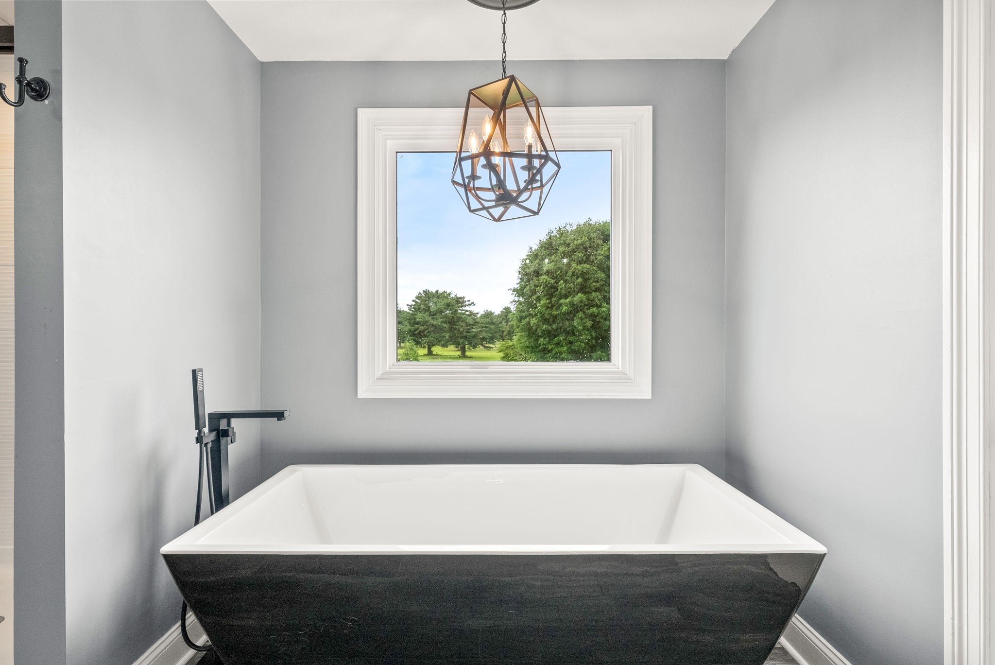 4921 Sango Road Clarksville, TN 37043 - Photo 29 of 52 a bath tub sitting in a bathroom next to a window