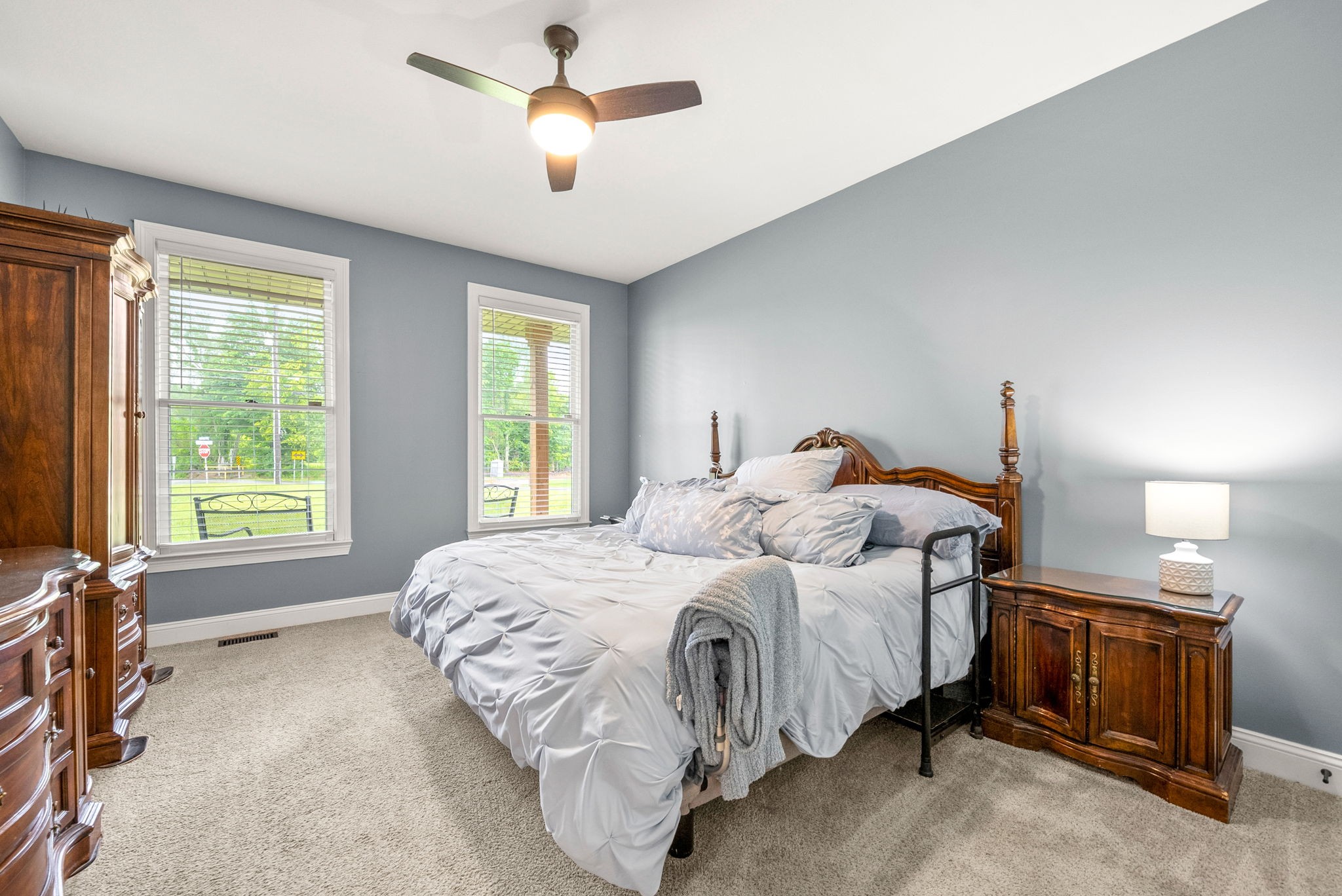 4921 Sango Road Clarksville, TN 37043 - Photo 32 of 52 a bedroom with a bed chandelier and a window