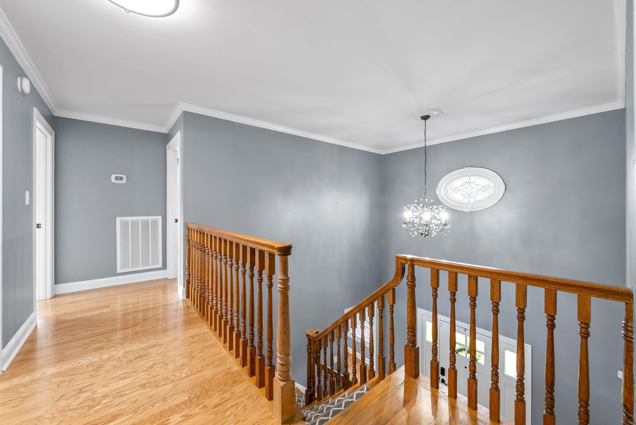 4921 Sango Road Clarksville, TN 37043 - Photo 40 of 52 a view of a hallway to room with wooden floor