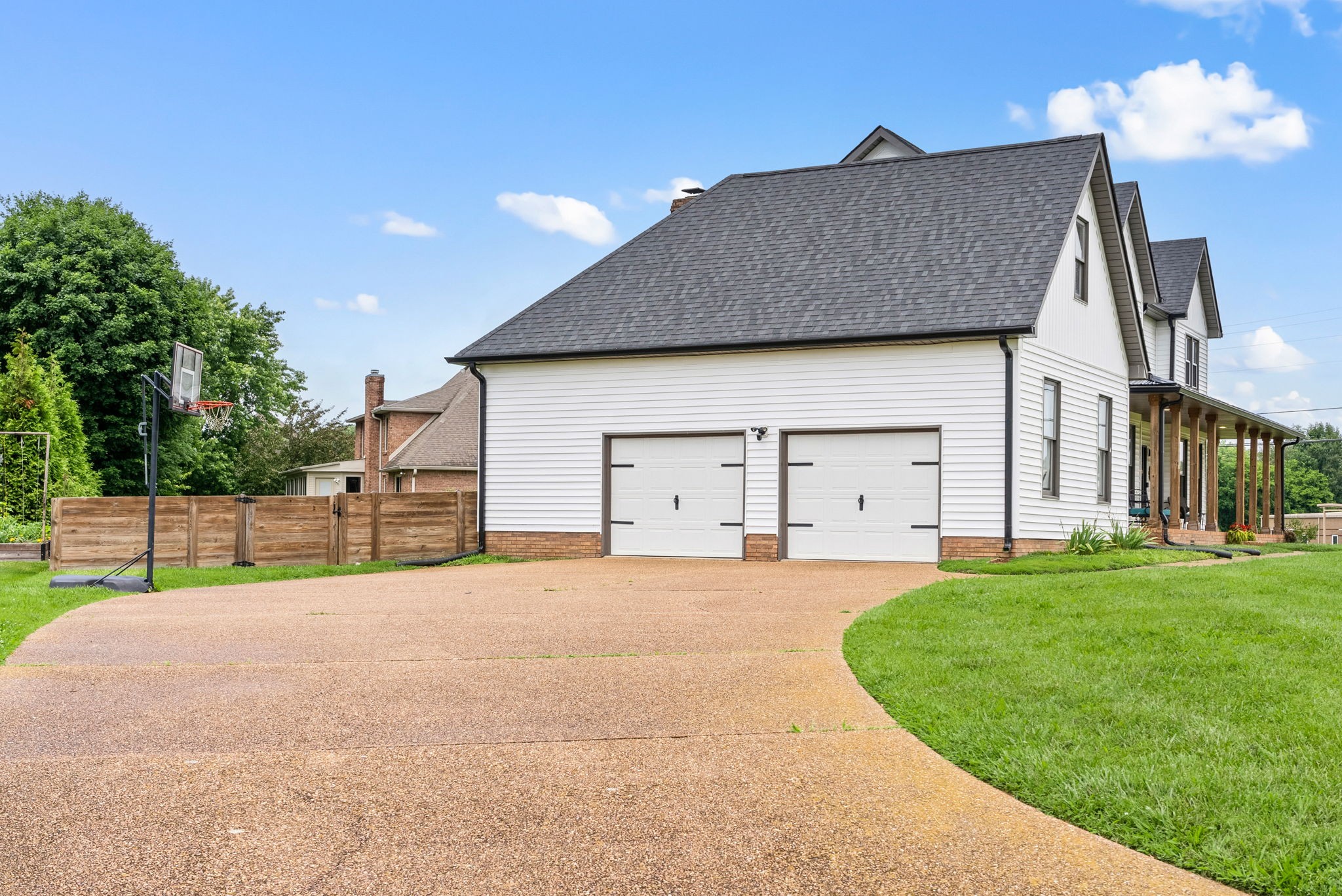 4921 Sango Road Clarksville, TN 37043 - Photo 4 of 52 a house that has a big yard and a large parking space