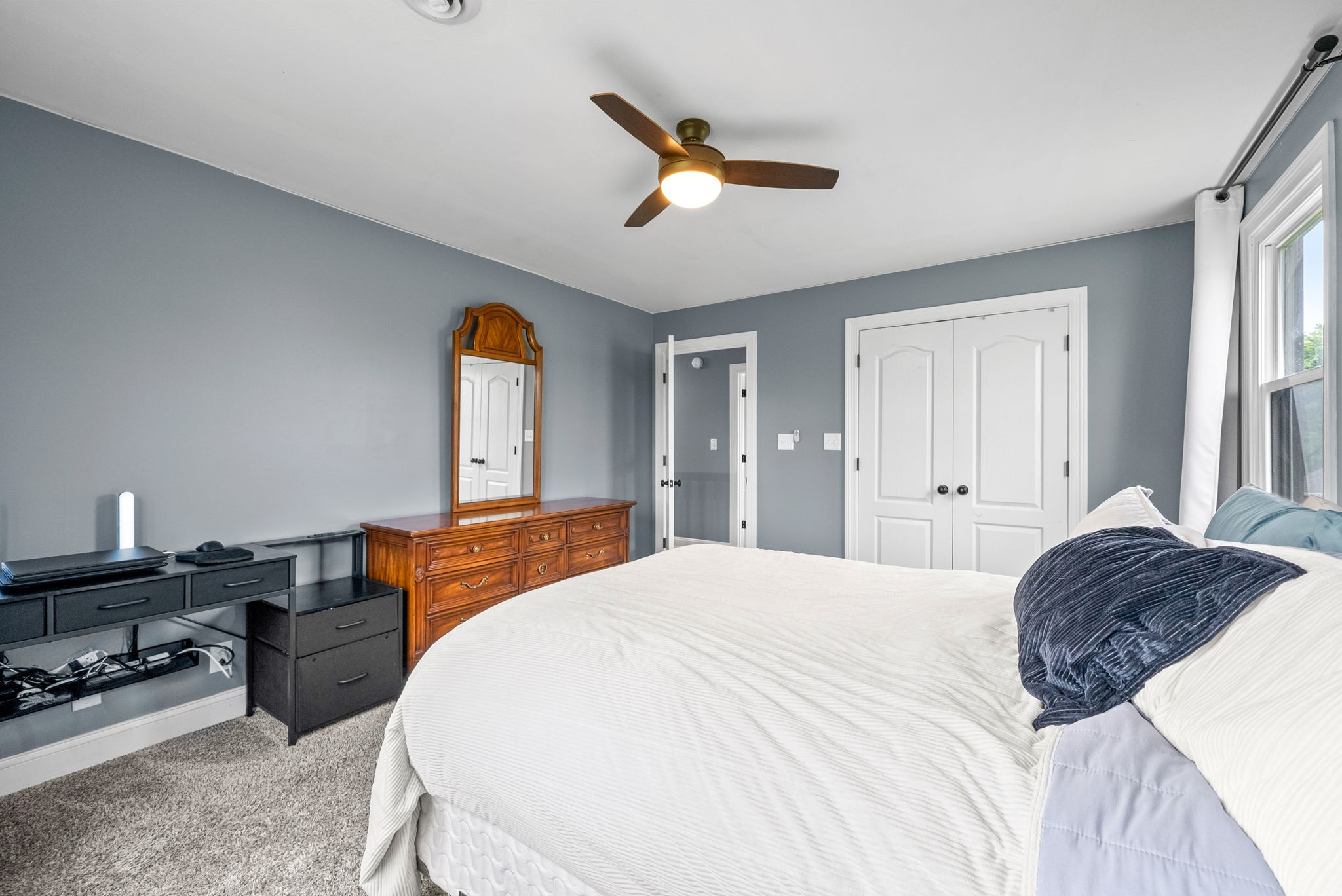 4921 Sango Road Clarksville, TN 37043 - Photo 43 of 52 a bedroom with a bed and a dresser