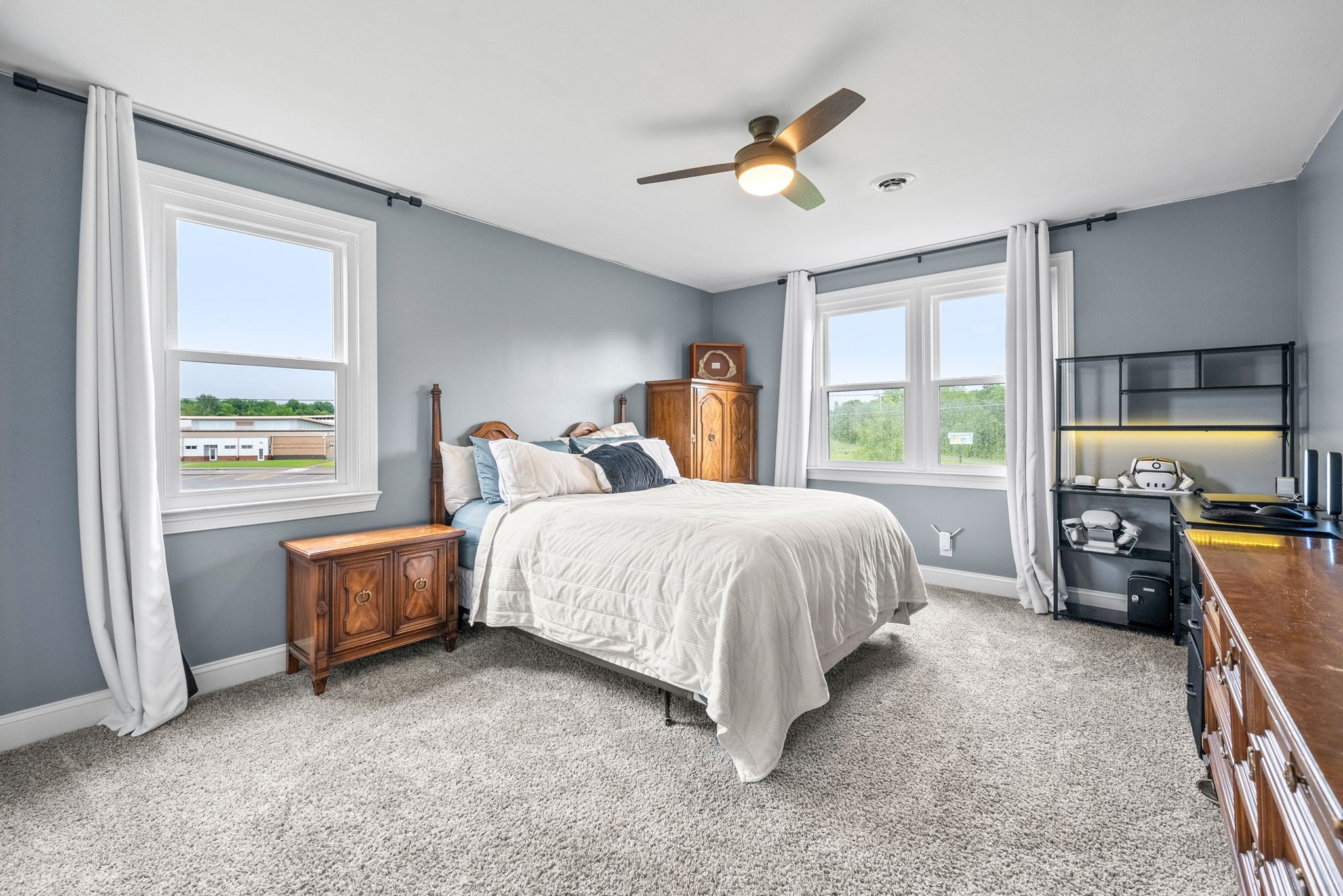 4921 Sango Road Clarksville, TN 37043 - Photo 44 of 52 a bed room with a bed and a chandelier