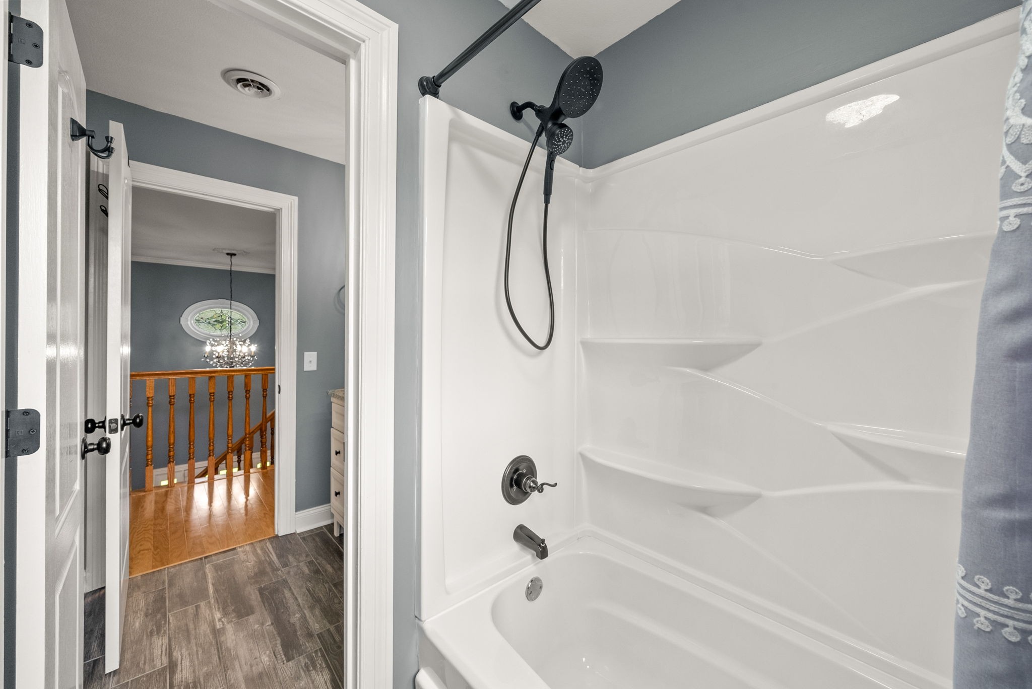 4921 Sango Road Clarksville, TN 37043 - Photo 46 of 52 a bathroom with a glass shower door